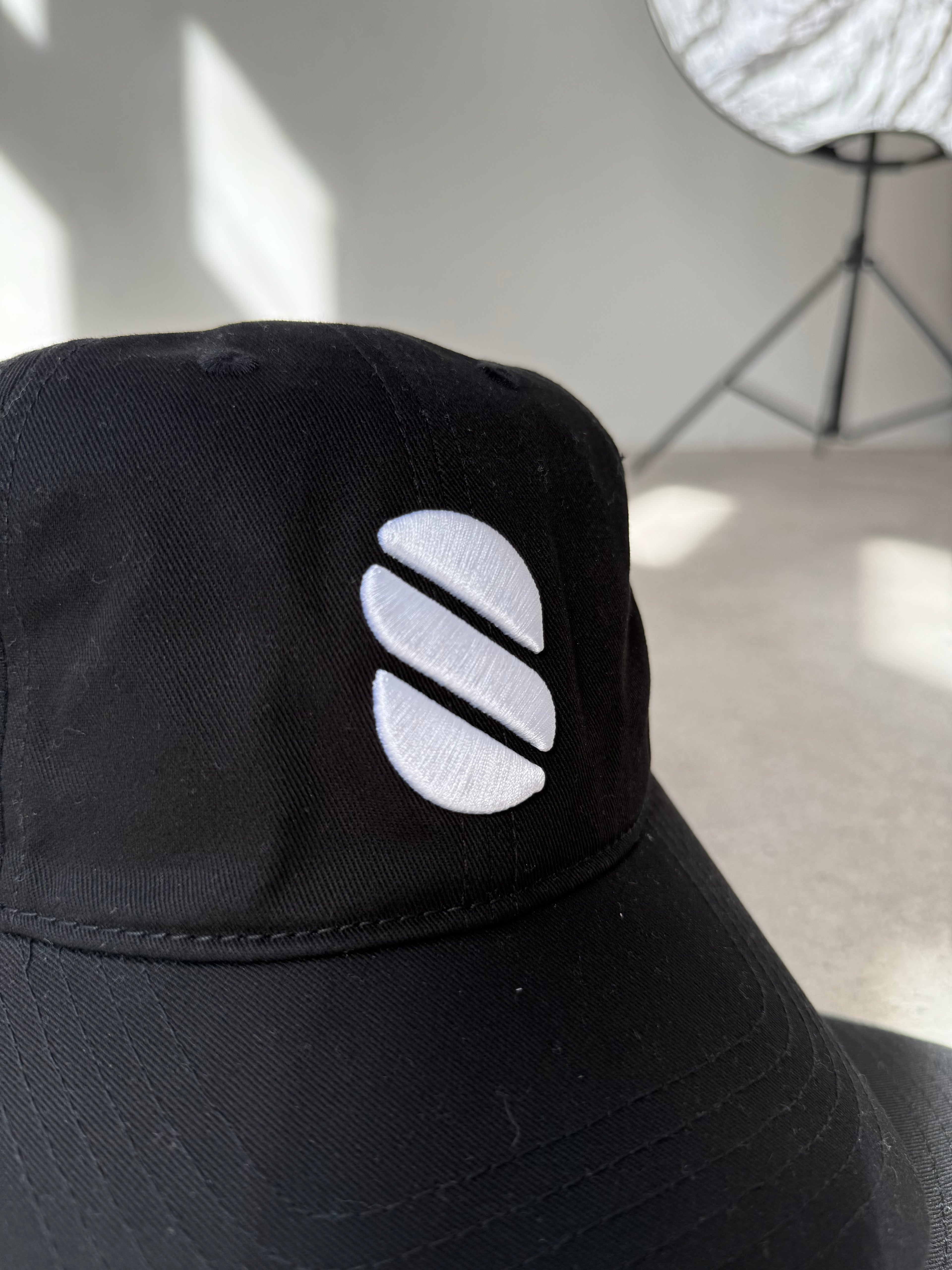 Black sleeve with a white logo on a light gray background